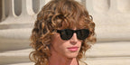 Creator Jordan Huxhold was seen wearing dark tortoiseshell Saint Laurent SL 798 Maxime 002 sunglasses with grey lenses at the Saint Laurent Menswear Spring/Summer 2026 fashion show during Paris Men's Fashon Week.