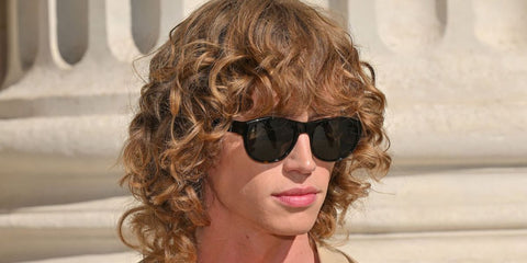 Creator Jordan Huxhold was seen wearing dark tortoiseshell Saint Laurent SL 798 Maxime 002 sunglasses with grey lenses at the Saint Laurent Menswear Spring/Summer 2026 fashion show during Paris Men's Fashon Week.