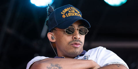 Jordan Stephens was seen wearing gold Ray-Ban RB 3547N 001 oval sunglasses onstage at the Glastonbury Festival 2025