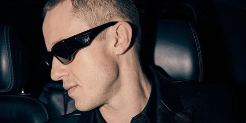 Joseph Quinn was seen wearing Prada PR 09ZS 16K30L sunglasses in an fashion editorial page of British GQ, November 2024