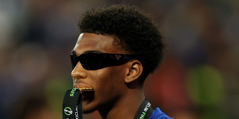 Footballer Josh Acheampong was seen wearing black Prada PR A14S 1AB5S0 wraparound sunglasses following the team's victory in the UEFA Conference League Final 2025.