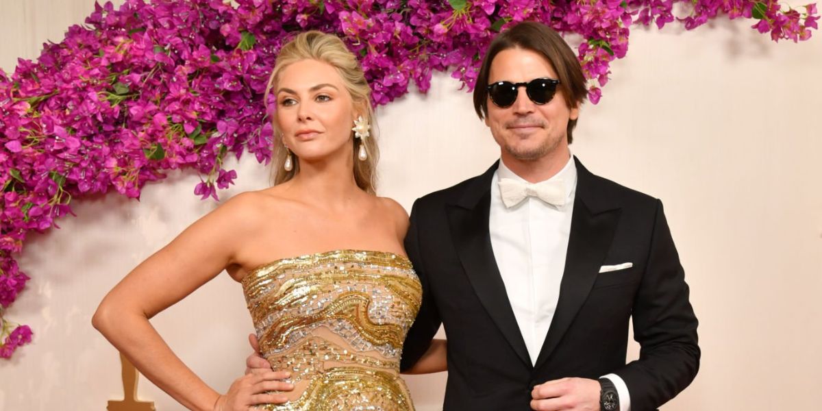 Josh Hartnett, pictured with wife Tamsin Egerton, was seen wearing black Oliver Peoples Gregory Peck Sun OV5217S 1031/P2 round sunglasses with grey Polarised lenses at the 96th Annual Academy Awards in Los Angeles
