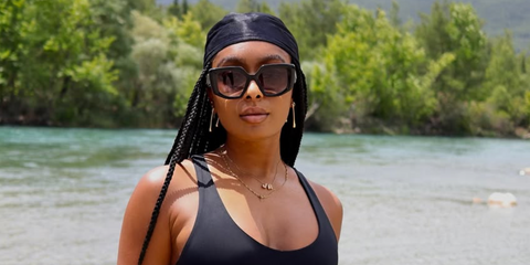 Internet personality Jourdan Riane was seen wearing black Prada PR 14ZS 1AB09S sunglasses with grey gradient lenses in her Instagram post, May 2025.