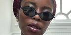 Wednesday actress Joy Sunday was seen wearing black Miu Miu MU 04ZS 1AB5S0 oval sunglasses in her Instagram post, June 2025. Shop online now on Pretavoir