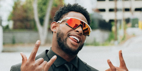 American football wide receiver JuJu Smith-Schuster was seen wearing Oakley BXTR OO9280 04 Prizm sunglasses in a collaborative editorial with Oakley