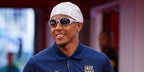 Jules Kounde was seen wearing grey silver Oakley Eye Jacket Redux OO9438 05 sunglasses with Prizm Polarised lenses