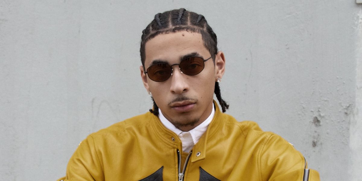 Julez Smith was seen wearing matte black Oliver Peoples Estra OV1347ST 5017/53 sunglasses with brown cognac lenses in a Numero Netherlands feature, Decemer 2024
