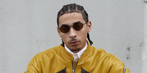 Julez Smith was seen wearing matte black Oliver Peoples Estra OV1347ST 5017/53 sunglasses with brown cognac lenses in a Numero Netherlands feature, Decemer 2024