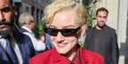 Julia Garner is seen wearing Gucci GG1779S 001 cat eye sunglasses to attend the brand's Spring/Summer 2025 fashion show in Milan