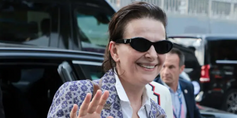 Juliette Binoche is seen wearing Prada PR 26ZS 16K08Z oval sunglasses to attend the Artistic Gymnastics Women's Team Final during day four of the Paris 2024 Olympic Games