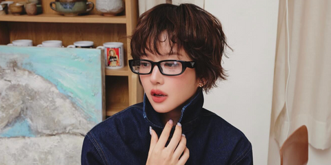 Thai actress and singer Junei Plearnpichayawas seen wearing black Prada PR B05V 16K1O1 optical glasses in her Instagram post, September 2025.