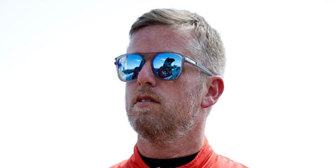 Professional stock car racing driver Justin Allgaier was seen wearing matte grey Oakley Latch Beta OO9436 06 sunglasses with sapphire Prizm Polarised lenses during qualifying for the NASCAR Xfinity Series Nu Way 200 Sauced by Blues Hog  in Illinois, September 2025.