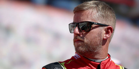 Professional stock car racing driver Justin Allgaier was seen wearing matte black Oakley Sylas OO9448 03 Prizm sunglasses.