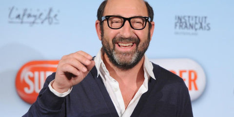 French-Algerian actor and director Kad Merad was seen wearing black Ray-Ban Wayfarer RB 2140 901/5F optical glasses in France. Shop online now on Pretavoir