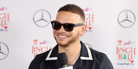 American country singer Kane Brown was seen wearing matte black Ray-Ban Meta Wayfarer RW4008 601/T3 Polarised Smart Glasses at the iHeart Radio 102.7 KIIS FM's Jingle Ball 2024 in New York City.