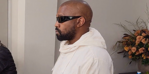 Kanye West was seen wearing black Prada PR A19S 1AB5S0 wraparound sunglasses in The Kardashians season 6 episode 3, which he wore again to the 2025 Grammy Awards