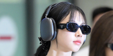 South Korean singer Karina of aespa was seen wearing black Prada PR 17WS 1AB5S0 Symbole Sunglasses at Incheon International Airport