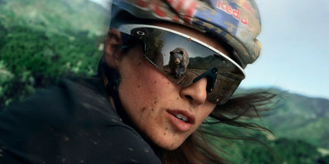 Professional cyclist Kate Courtney was seen wearing white Oakley Meta Vanguard OW8001 05 Prizm Smart Glasses n Oakley Super Bowl 2026 campaign.