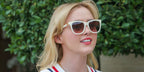 Kathryn Newton was seen wearing white cream Polo Ralph Lauren PH4201U 6057/13 sunglasses with brown gradient lenses in Paris, August 2024