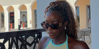 Television personality Kaz Kamwi of Love Island (2021) was seen wearing tortoiseshell Miu Miu MU 09WS 14L20I sunglasses with brown purple lenses in Zanzibar, shared through her Instagram post in August 2025.
