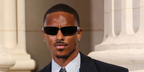 Keith Powers was seen wearing black Saint Laurent Sun SL 963 001 wraparound sunglasses at the Saint Laurent Menswear Spring/Summer 2027 fashion show during Paris Men's Fashion Week.