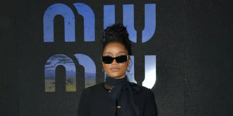 Keke Palmer was seen wearing black Miu Miu MU 09WS 1AB5S0 cat eye sunglasses to attend the Miu Miu Spring/Summer 2023 fashion show during Paris Fashion Week