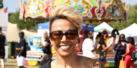Middle-distance running legend Kelly Holmes was seen wearing transparent brown and beige Versace 4405 5332/13 sunglasses during UK Black Pride Celebrates 20th Anniversary in London, August 2025. Shop online now on Pretavoir