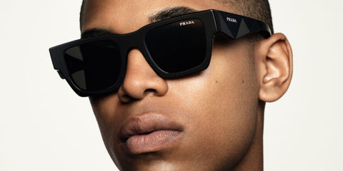 Kelvin Harrison Jr. is seen modeling Prada PR A06S 16K08Z square sunglasses in the brand's eyewear campaign