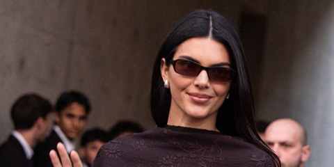 Kendall Jenner was seen wearing DMY Studios Juno DMYSUN10SB Black sunglasses with brown lenses at the Emporio Armani Fall/Winter 2026 fashion show during Milan Fashion Week.