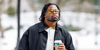 American football player Kenny Moore II of Indianapolis Colts was seen wearing metal rust Miu Miu MU A02S 16Y8G1 sunglasses with gold mirrored lenses in New York City, February 2026.