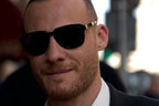 Turkish-American actor Kerem Bursin wore black Dolce&Gabbana DG4566 501/87 sunglasses at the Dolce & Gabbana Spring/Summer 2027 show during Milan Fashion Week.