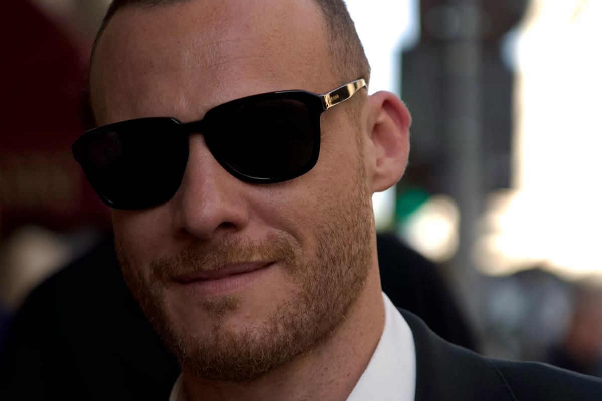 Turkish-American actor Kerem Bursin wore black Dolce&Gabbana DG4566 501/87 sunglasses at the Dolce & Gabbana Spring/Summer 2027 show during Milan Fashion Week.