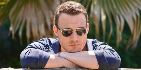 Turkish-American actor Kerem Bursin was seen wearing gold Persol 1006S 515/3R Polarised sunglasses, photographed by Yigit Danaci. Shop online now on Pretavoir