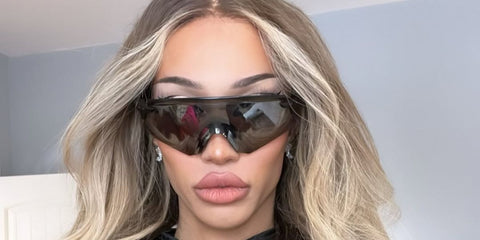 Drag performer Kerri Colby was seen wearing Oakley Encoder OO9471 03 Prizm sunglasses in her Instagram post, December 2024.