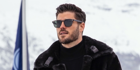 Model Kevin Lutolf was seen wearing black Garrett Leight Ace 2081 BK/SFBS sunglasses with blue lenses in Switzerland, shared through his Instagram post in December 2025.