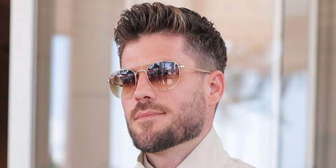 Model Kevin Lutolf was seen wearing gold Ray-Ban RB 3707 001/51 sunglasses with brown gradient lenses at the Cannes Film Festival 2025.