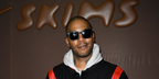 Kid Cudi was seen wearing black Saint Laurent Sun SL M146 001 sunglasses at the Paris launch of NikeSKIMS, February 2026.