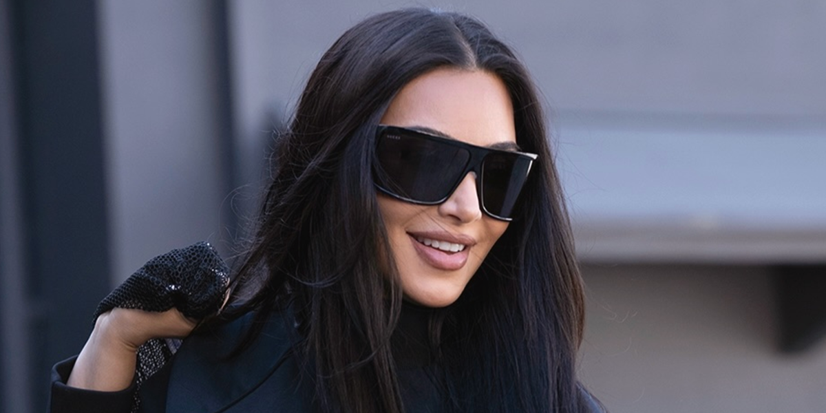 Kim Kardashian was seen wearing black Gucci GG2274S 001 shield sunglasses on the set of Nike Project photo shoot in June 2026.