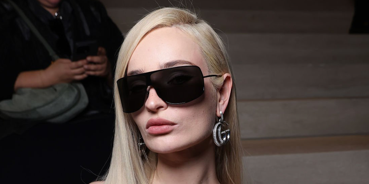 Kim Petras was seen wearing black Gucci GG2276S 001 angular shield sunglasses at the Gucci Fall/Winter 2026 fashion show during Milan Fashion Week.