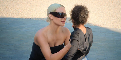 Kim Kardashian was seen wearing black Gucci GG1633S 004 wraparound sunglasses in The Kardashians season 6 episode 3