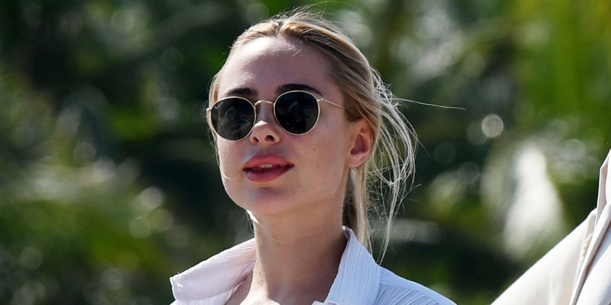 Entrepreneur and television personality Kimberley Garner of Made In Chelsea was seen wearing gold Ray-Ban Round Metal 3447 11258 sunglasses with green Polarised lenses in Miami, February 2023.