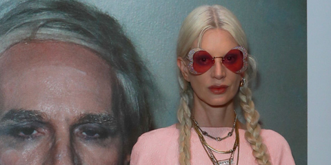 Supermodel Kristen McMenamy was see wearing crystal embellished Gucci Hollywood Forever GG0897S 001 butterfly sunglasses with pink red lenses at the ES x Beauty Papers: Unseen Warhol exhibition in London, October 2023