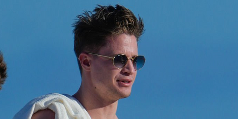 Norwegian DJ Kygo was seen wearing gold Ray-Ban Jack RB 3565 001/86 sunglasses with blue gradient lenses in Miami, February 2023.