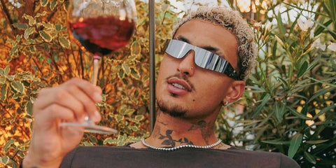 Kyle Kuzma is seen wearing metal Balenciaga BB0041S 002 wraparound sunglasses in a social media account