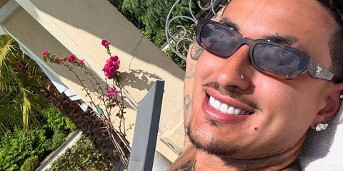 Basketball player Kyle Kuzma was seen wearing tortoise Prada PR B06S 20D50Q sunglasses with grey lenses in his Instagram post, July 2025
