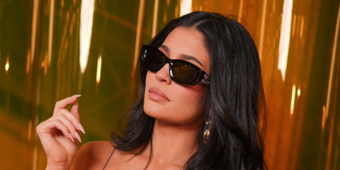 Kylie Jenner was seen wearing black Miu Miu MU B04S 16K08Z sunglasses at the Miu Miu Spring/Summer 202 fashion show during Paris Fashion Week. Shop online now on Pretavoir
