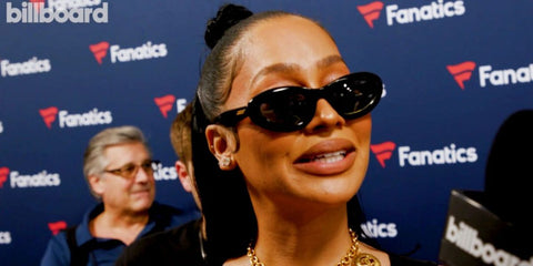 La La Anthony was seen wearing black Bottega Veneta BV1191S 001 oval sunglasses at the Super Bowl 2025 party.