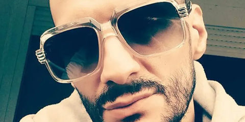 French rapper Lacrim was seen wearing transparent Cazal Legends 607/3 065 sunglasses with grey gradient lenses. Shop online now on Pretavoir