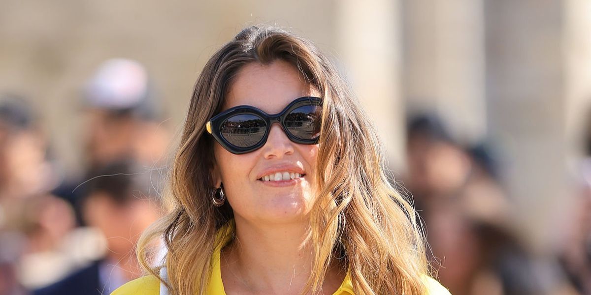 Model Laetitia Casta wore Loewe Coil LW40204I 01A cat eye sunglasses at the Loewe Spring Summer 2027 show during Paris Fashion Week