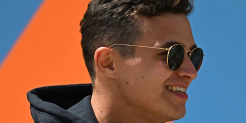 Formula 1 driver Lando Norris wearing Ray-Ban round metal polarised sunglasses